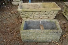 Two composite rectangular garden troughs.