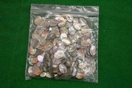 A bag of abalone shell discs.