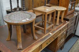 Two African bead work decorated stools and another stool.