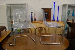 A set of four stylish perspex and chrome framed dining chairs.