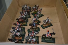 Cast metal military figures on horseback.