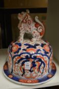 A large Imari jar lid with lion finial.