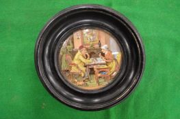 A pair of porcelain pot lids, framed.