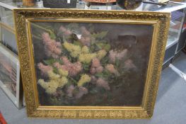 Floral subject, oil on canvas, in a large decorative gilt frame (faults).