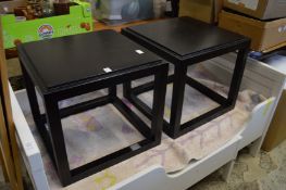 A pair of modern occasional tables.