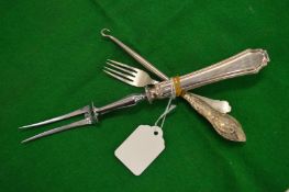 Silver fork, silver handled carving fork and a button hook.