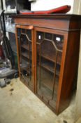 A mahogany bookcase top.