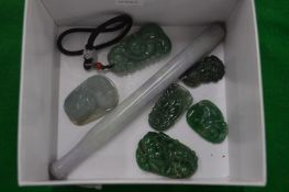 A collection of jade amulets and other items.