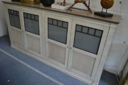 A stylish painted French four door low cupboard.
