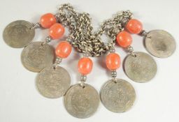 A BEADED METAL NECKLACE WITH ISLAMIC COINS.