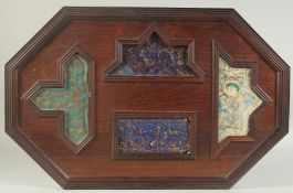 FOUR 12TH/13TH CENTURY PERSIAN LAJVARDINA AND KASHAN LUSTRE POTTERY TILES, united in a wooden frame,