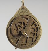 A FINE 19TH CENTURY PERSIAN QAJAR ENGRAVED BRASS ASTROLABE, 6.5cm wide.