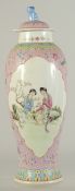 A CHINESE FAMILLE ROSE PORCELAIN VASE AND COVER, with two panels of female figures, character mark