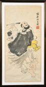 A CHINESE PAINTING OF A CALLIGRAPHER, inscribed and with red seal mark, framed and glazed, 65cm x