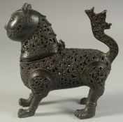 AN ISLAMIC OPENWORK BRASS LION INCENSE BURNER, 17.5cm long.