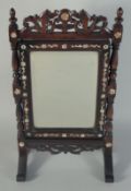 A 19TH CENTURY CHINESE MOTHER OF PEARL INLAID HARDWOOD MIRROR ON STAND, 45cm high, 24.5cm wide