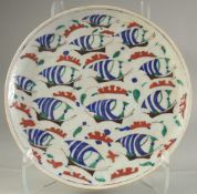 A TURKISH OTTOMAN GLAZED POTTERY PLATE, 30.5cm diameter.
