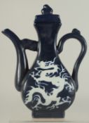 A CHINESE SACRIFICIAL BLUE GLAZE LIDDED EWER, with incised white dragon, 29cm high.