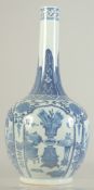 A CHINESE BLUE AND WHITE PORCELAIN BOTTLE VASE, painted with panels of beasts and objects, the