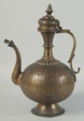 A FINE 19TH CENTURY ISLAMIC INDIAN ENGRAVED BRASS EWER, with hinged lid and floral decoration,