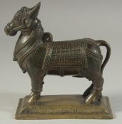 A 19TH CENTURY INDIAN BRONZE BULL NANDI, stood upon a rectangular base, 15cm long.