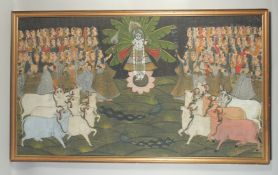 A VERY LARGE 19TH / EARLY 20TH CENTURY FRAMED INDIAN PAINTED TEXTILE, depicting Krishna amongst