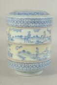 CHINESE BLUE AND WHITE PORCELAIN STACKING RICE BOWLS AND COVER, painted with figures in a garden,