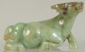 A LARGE CHINESE CARVED JADE BULL, 21cm long.