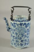 A 19TH-20TH CENTURY CHINESE BLUE AND WHITE TEAPOT, possibly for the Thai market, 25cm high (