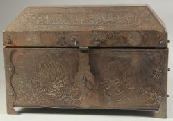A LARGE ISLAMIC SILVER AND GOLD INLAID METAL CASKET, with panels of calligraphic inscriptions,