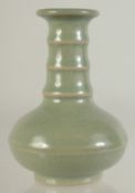 A SMALL CHINESE CELADON GLAZE VASE, 10cm high.