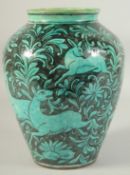 A PERSIAN QAJAR NATANZ GLAZED POTTERY VASE, painted with a figure on horseback and other animals,