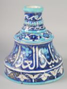 A VERY UNUSUAL LARGE 19TH CENTURY INDIAN MULTAN IZNIK STYLE GLAZED POTTERY CANDLESTICK, with a