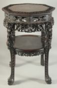 A FINE CHINESE MARBLE INSET CARVED HARDWOOD OCTAGONAL STAND, with carved and pierced foliate