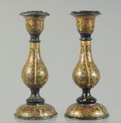 A PAIR OF INDIAN KASHMIRI LACQUERED CANDLESTICKS, 16cm high.