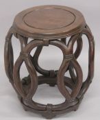 A CHINESE BARREL FORM STAND.