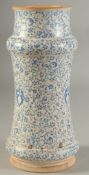 AN ISLAMIC POTTERY MEDICINE JAR, 25.5cm high.