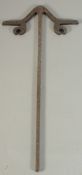 AN ISLAMIC SILVER AND GOLD INLAID STEEL DERVISH STICK, for hanging kashkul, inscribed, 57.5cm long.