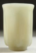 A SMALL CARVED JADE CUP, 4.5cm high.