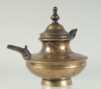 A 17TH-18TH CENTURY INDIAN BRASS SQUAT-FORM EWER, 17cm wide (including spout).