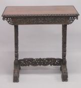 A FINE 19TH CENTURY ANGLO-INDIAN TABLE, with finely carved and pierced folaite skirt and legs,
