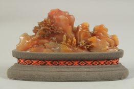 A FINE EARLY 20TH CENTURY CHINESE SOAPSTONE LANDSCAPE GROUP, with purpose-made stand and fitted box,