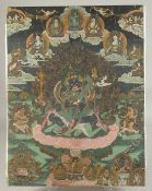 A TIBETAN THANGKA PAINTING, overlaid on wooden board, 63.5cm x 48.5cm.