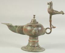 A LARGE SELJUK KHORASAN BRONZE OIL LAMP, with twin animal finials to each side and large bird form