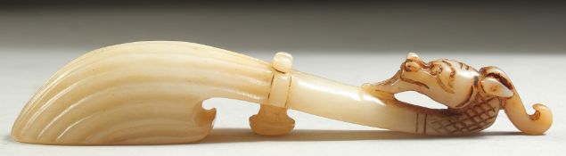 A CHINESE JADE BELT HOOK, 12cm long.