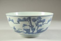 AN EARLY 20TH CENTURY CHINESE BLUE AND WHITE PORCELAIN BOWL, painted with a figure in a landscape,