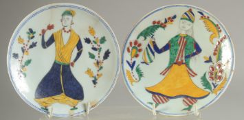 A PAIR OF TURKISH KUTAHYA DISHES, 14cm diameter.