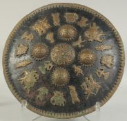 A FINE 19TH CENTURY INDIAN METAL SHIELD, with applied brass figural decoration and four raised brass