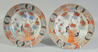 A PAIR OF POLYCHROME PORCELAIN PHOENIX PLATES, further painted with flora and gilt highlights,