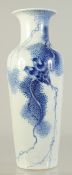 AN EARLY 20TH CENTURY CHINESE BLUE AND WHITE PORCELAIN VASE, painted with birds on a branch with